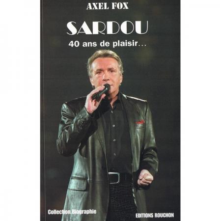 michel sardou Chante:spectacle,cuir bien habillé tjours charmant,tempes cheveux gris,mais tjours séduisant 