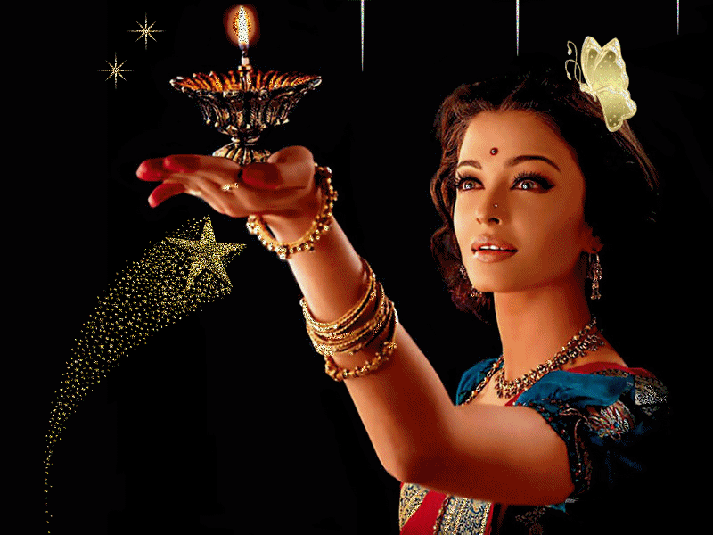 J'aime bientout ce qui a attrait avc l'INDE Musique Habits Coutumes�cette femme type hindou superbe beau visage,papillon dns les cheveux noirs brillants,beaux bijoux,robe typique,porte un bo