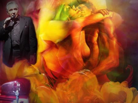 Michel chant,sr sc&egrave;ne,plus haut on le voit chanter,encostumNoir�chante l'Amour la Passion Beaut&eacute;�avec ce couple s'aime dns leur intimit&eacute; Belle couleurs�orang&eacute; rouges j'ador ces couleurs