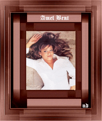 Dans cadre marron plutot pas mal  dor&eacute; blanc noir gris, l'on voit  une jeun belle chanteuse et que j'aime bien:  Amel Bent,  et ses chansons !!! A  DEMAIN   Bizz   et  bon week end,  &agrave; ts tt